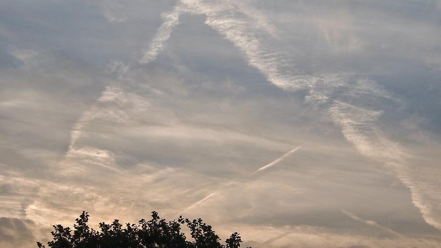 Triangle clouds or invisible ufo Photograph by Marco De Mooy - Fine Art