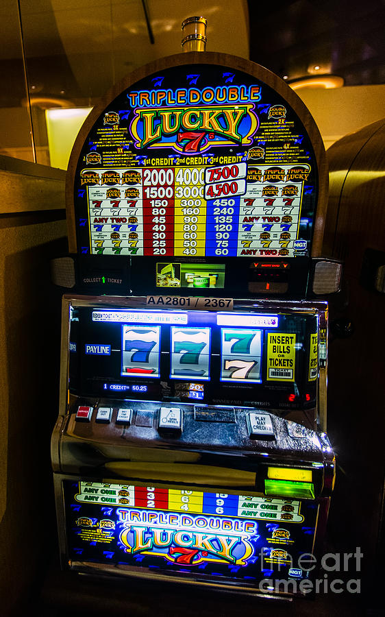 Triple Lucky 7s Slot Machine at Lumiere Place Casino Photograph by David Oppenheimer