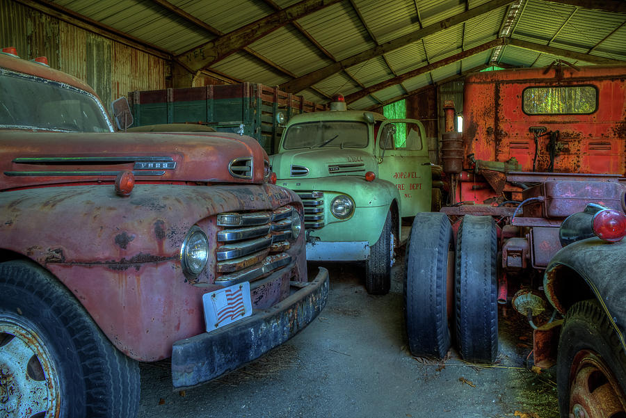 Truck Graveyard Warehouse Photograph by Jerry Gammon