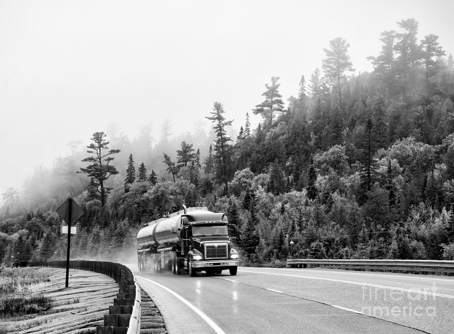 Truck on foggy highway Photograph by Les Palenik