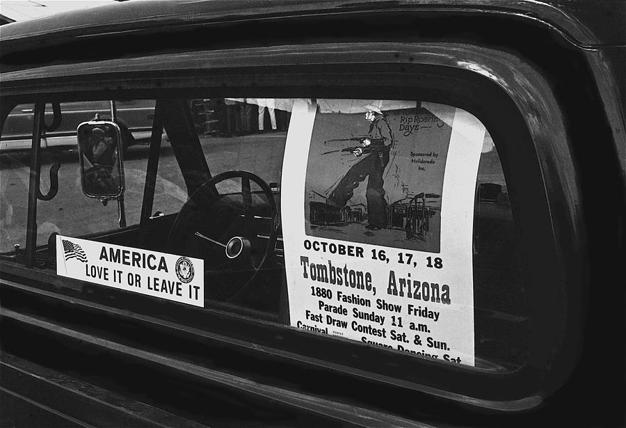 Truck with right wing decal and Helldorado Days poster Tombstone Arizona 1970 Photograph by David Lee Guss