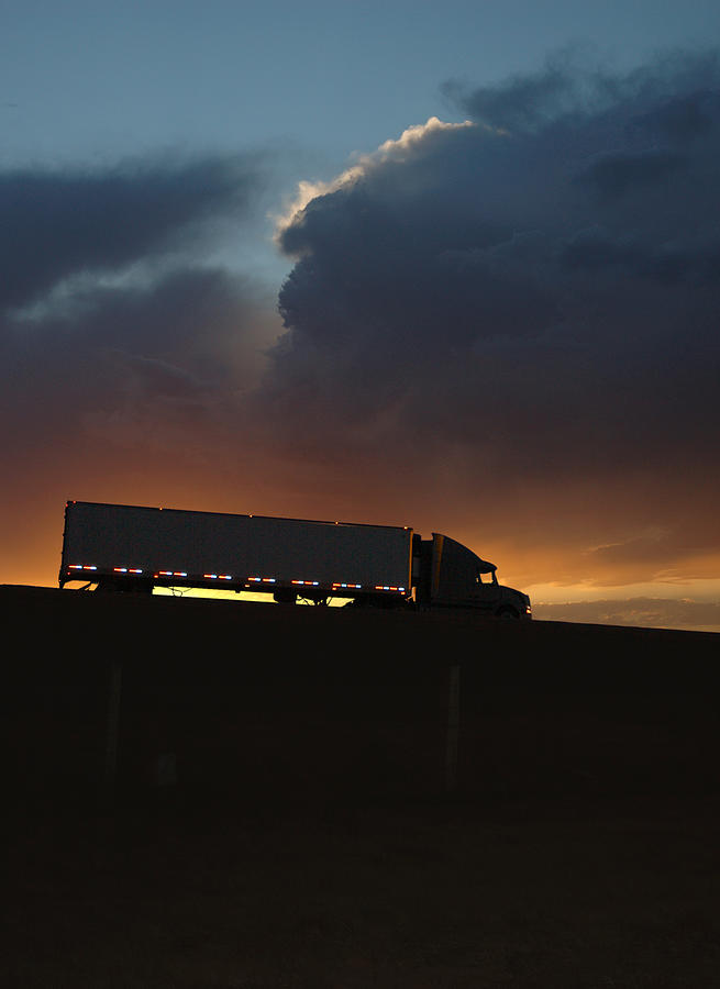 Sunset Photograph - Trucking Along by Jerry McElroy