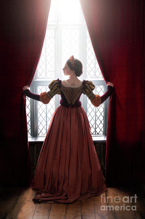 Tudor woman parting curtains Photograph by Lee Avison