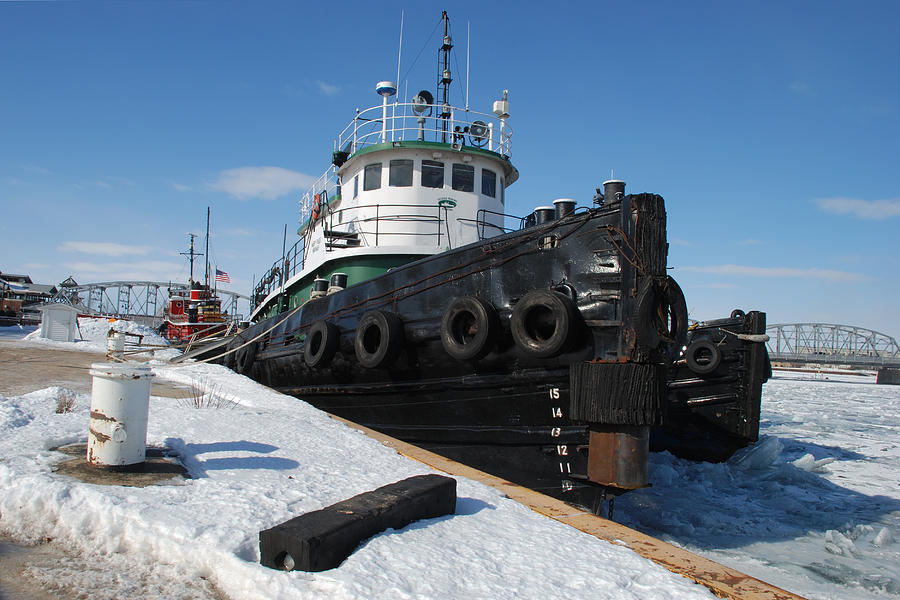 Tugs Docked For Winter Photograph by Janice Adomeit