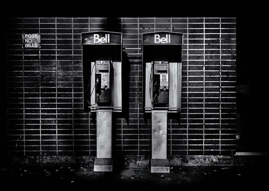 Blackandwhite Photograph - Twin Booths Outside Of Wellesley Subway by Brian Carson