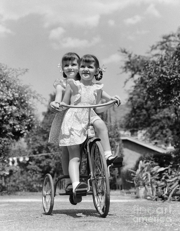 Twin Girls On A Tricycle, C.1940s Photograph by H. Armstrong Roberts/ClassicStock
