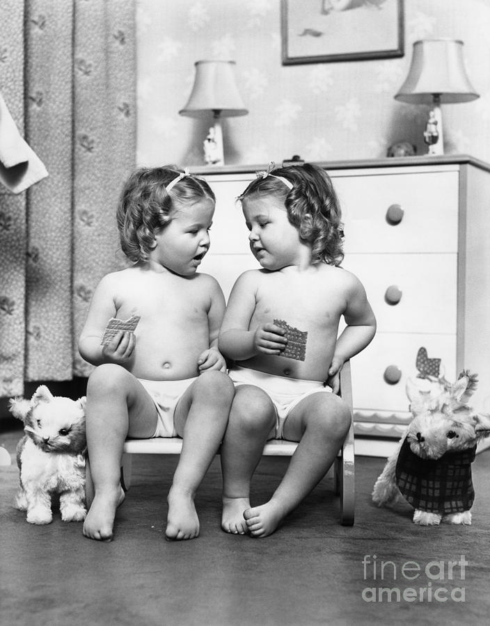 Toy Photograph - Twin Girls Sitting In A Double Seat by H. Armstrong Roberts/ClassicStock