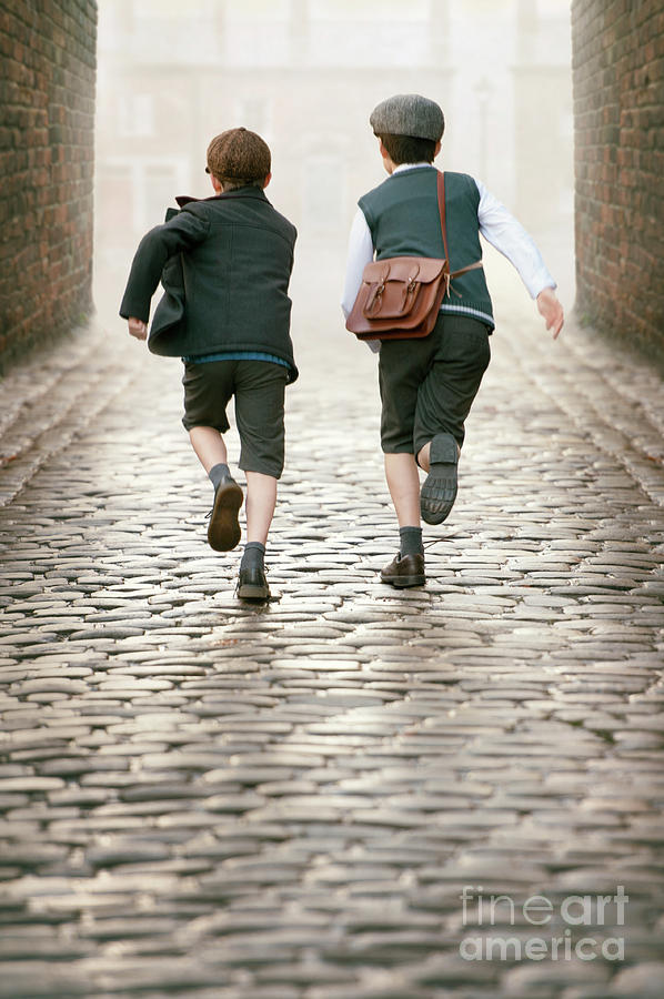 Two 1940s Boys Running Down A Cobbled Alleyway Photograph by Lee Avison