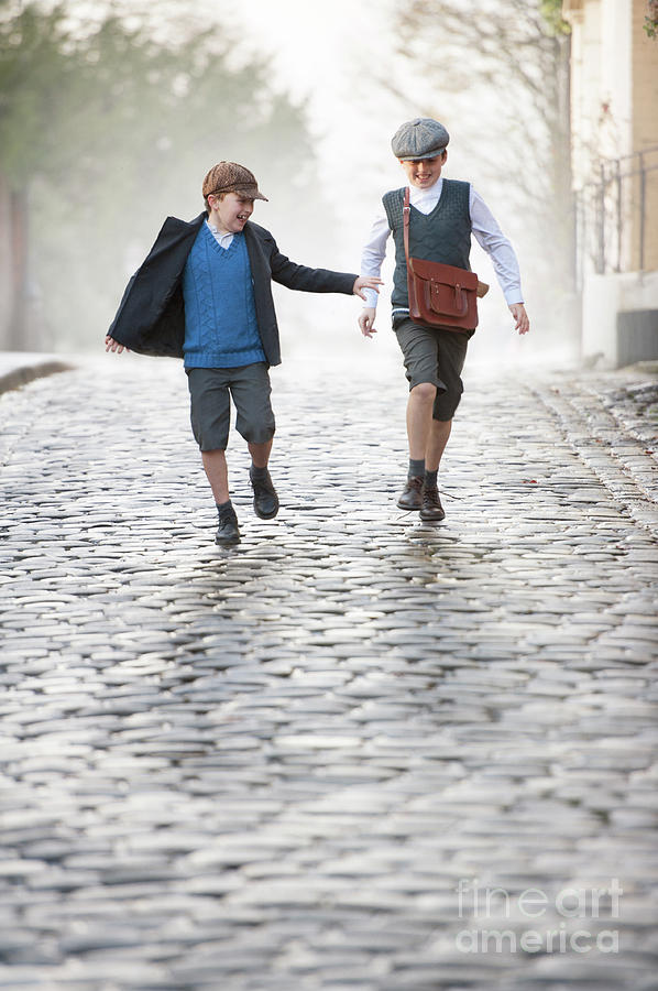 Two 1940s Boys Running Down A Cobbled Street Photograph by Lee Avison