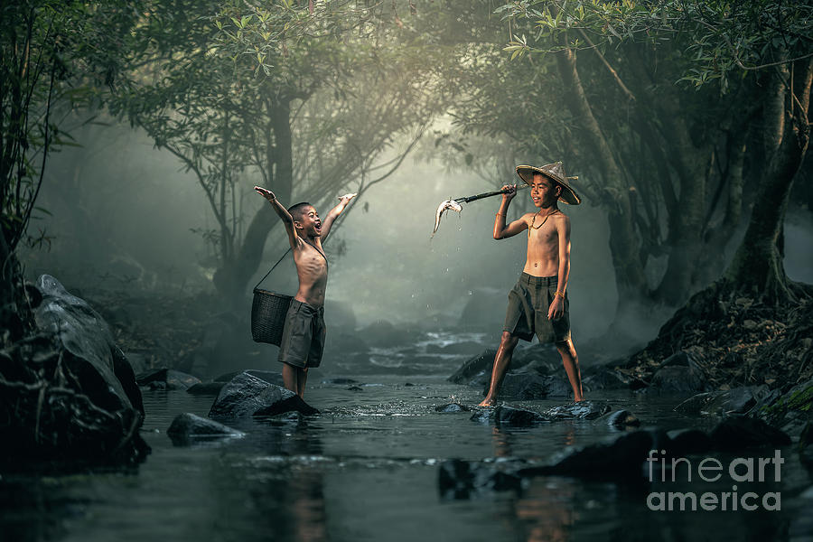 Two boys fishing in creeks Photograph by Sasin Tipchai - Pixels