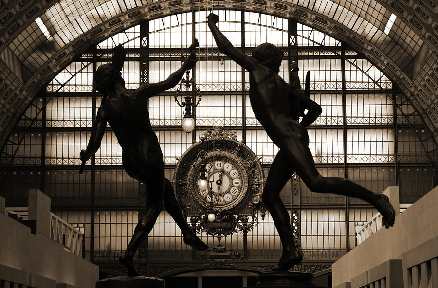 Two bronze sculptures framing great Gold Clock Orsay Museum Great Hall Paris France Sepia Photograph by Shawn OBrien