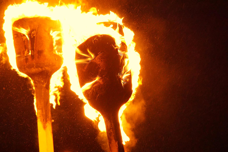 Two burning torches at Up Helly Aa Photograph by Jolly Van der Velden