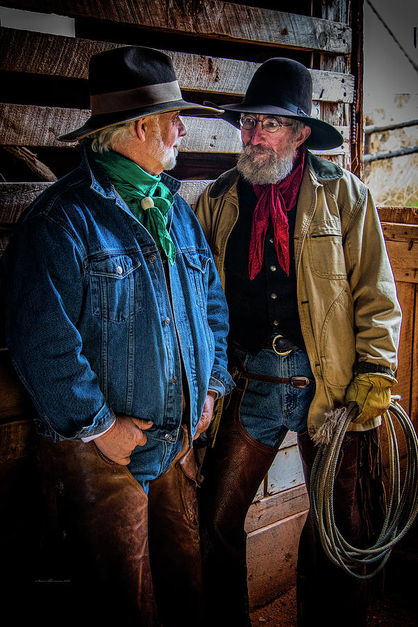Two Cowboys Talking in Barn Photograph by Sam Sherman