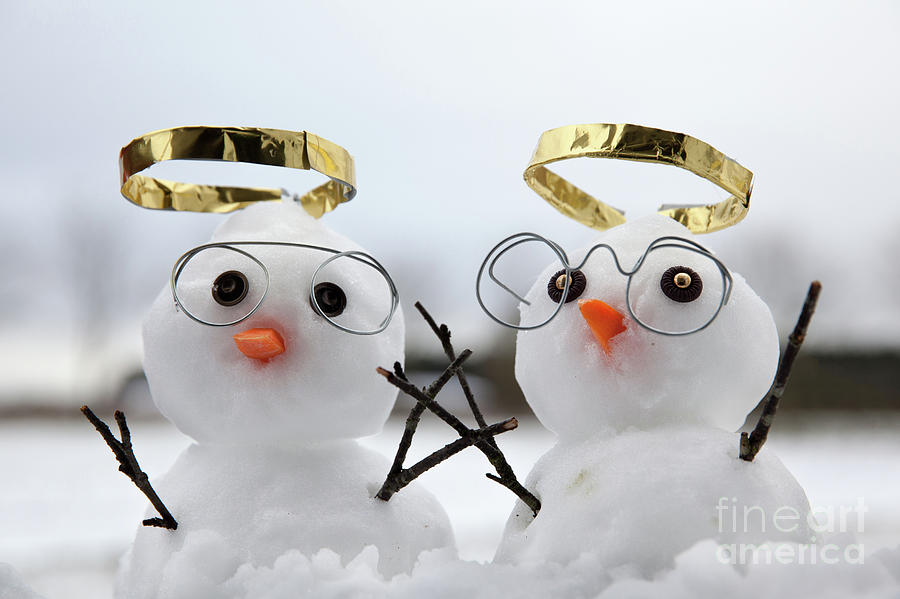 Two cute snowman angles with golden halos Photograph by Simon Bratt