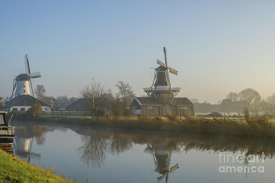 Two dutch windmills in the fog Photograph by Patricia Hofmeester