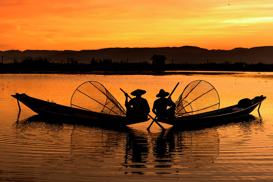 Two fisherman at sunset Photograph by Pradeep Raja Prints