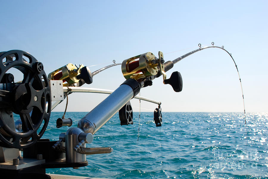 Two Fishing Poles on Back of Boat Photograph by Paul Velgos - Fine