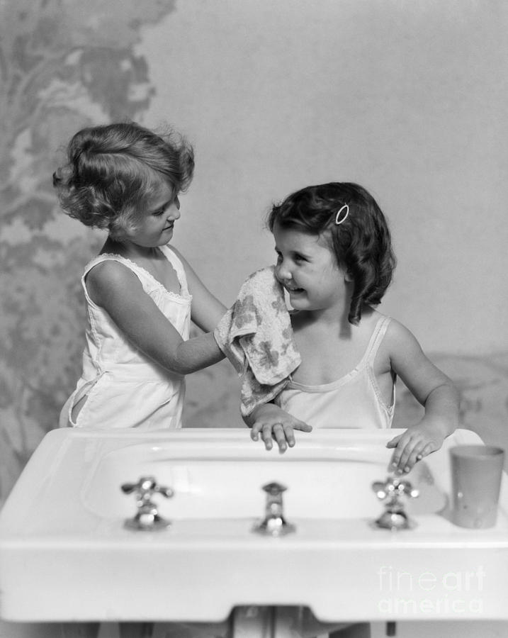 Two Girls At Bathroom Sink, C.1930s Photograph by H. Armstrong Roberts/ClassicStock