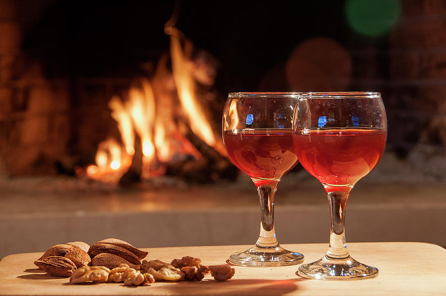 Two Glass Of Wine In Front Of A Fireplace Photograph By Manolis