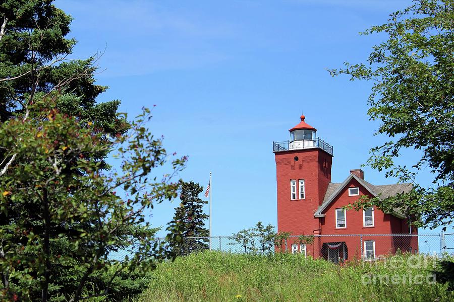Two Harbors Lighthouse Photograph by Jimmy Ostgard