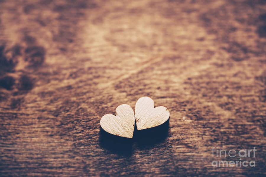 Two hearts on a wooden background Photograph by Michal Bednarek
