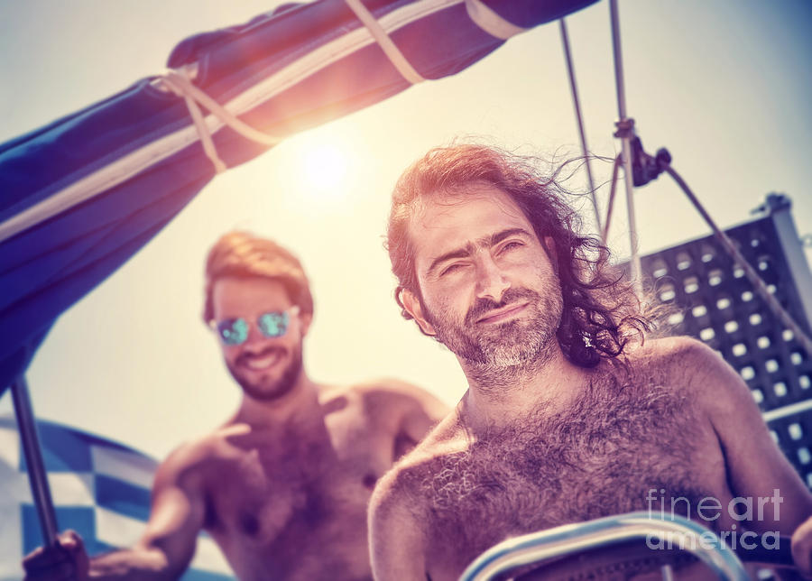 Two men on sailboat Photograph by Anna Om