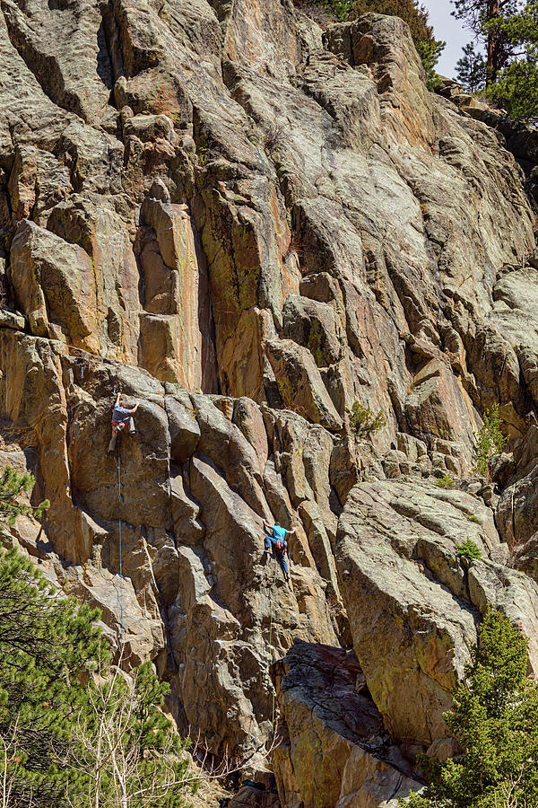 Two Rock Climbers Making Their Way Photograph