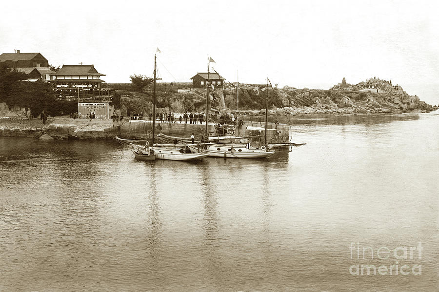 Pier Photograph - Two sail boats at pier at Lovers Point Beach Circa 1915 by Monterey County Historical Society