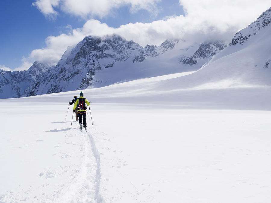 Two Skiers Ski Touring Photograph by Penny Kendall - Fine Art America