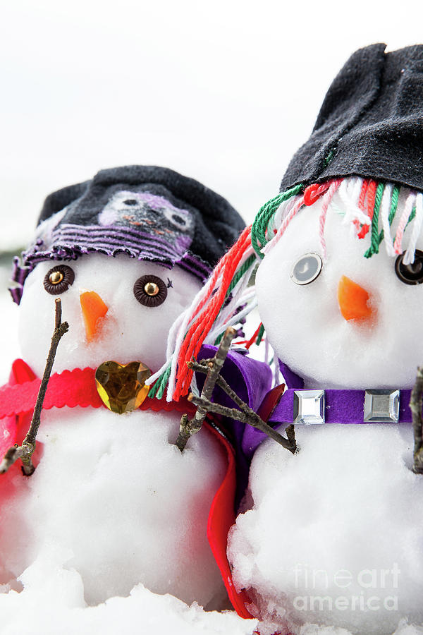 Two stylish snowmen dressed beautifully Photograph by Simon Bratt