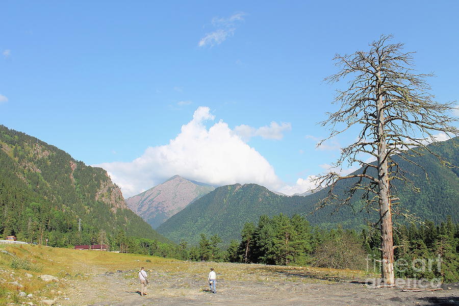 Two Tourists Walk Along The Mountain Path, The Caucasus. Photograph