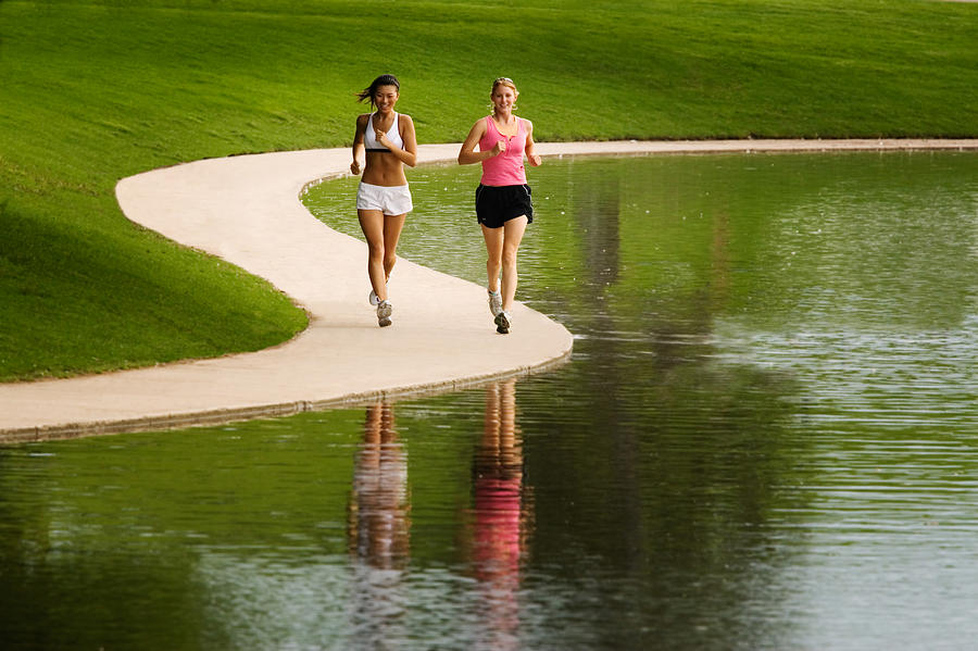 Two Women Jogging Photograph by Douglas Pulsipher