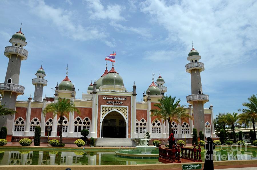 Two women pose at Pattani central mosque courtyard with pond minarets and Thai flag Thailand Photograph by Imran Ahmed