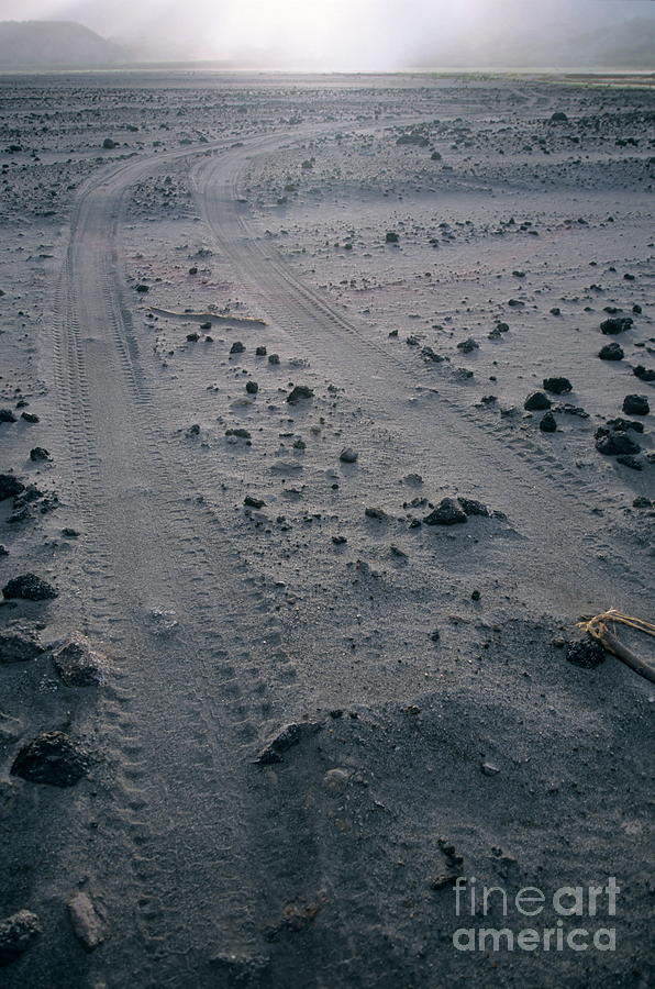 Landscape Photograph - Tyre tracks and lava rocks on the vast ash plain near Mount Yasur by Sami Sarkis
