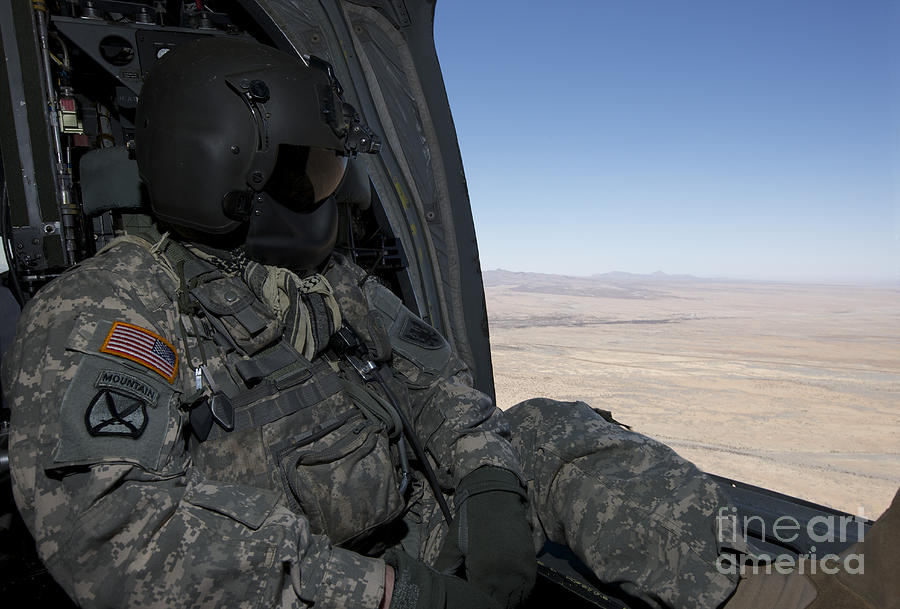 Uh-60 Black Hawk Crew Chief Takes Photograph by Terry Moore