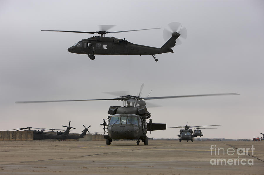 Uh-60 Black Hawks Taxis Photograph by Terry Moore