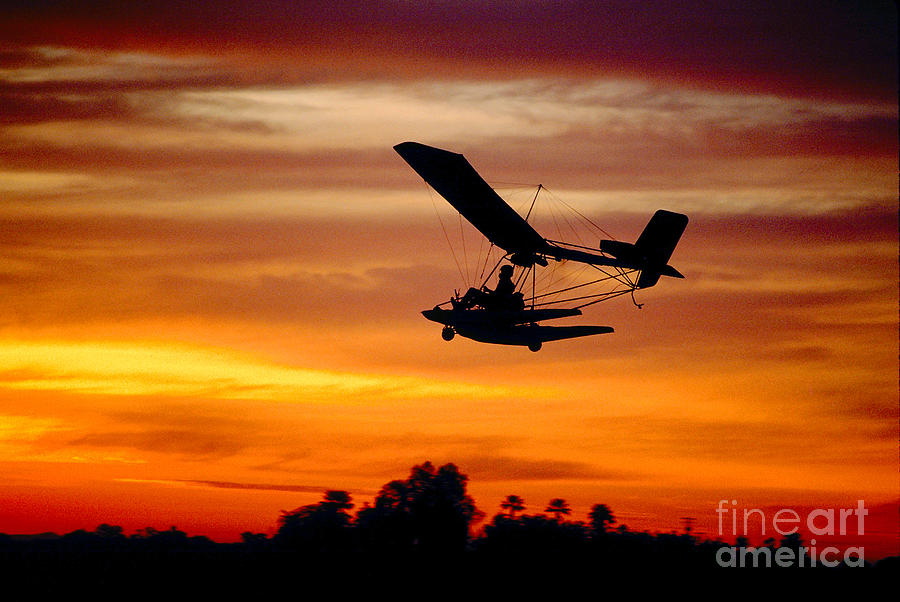 Ultralight Aircraft Flying in the Magical Sunset Photograph by Wernher Krutein