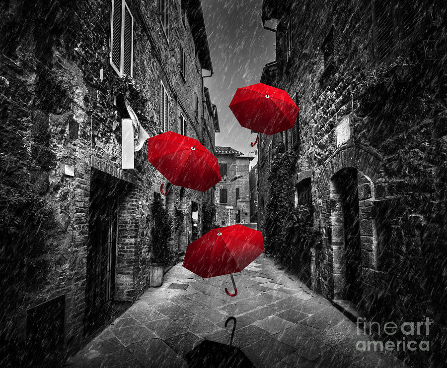 Umrbellas flying with wind and rain on dark street in an old Italian town in Tuscany, Italy Photograph by Michal Bednarek