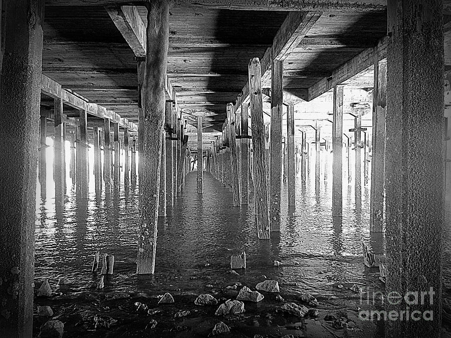 Black And White Photograph - Under The Boardwalk - Walton On The Naze Pier by J J  Everson