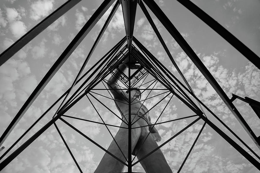 Under the Oil Derrick - Tulsa Golden Driller in Black and White Photograph by Gregory Ballos