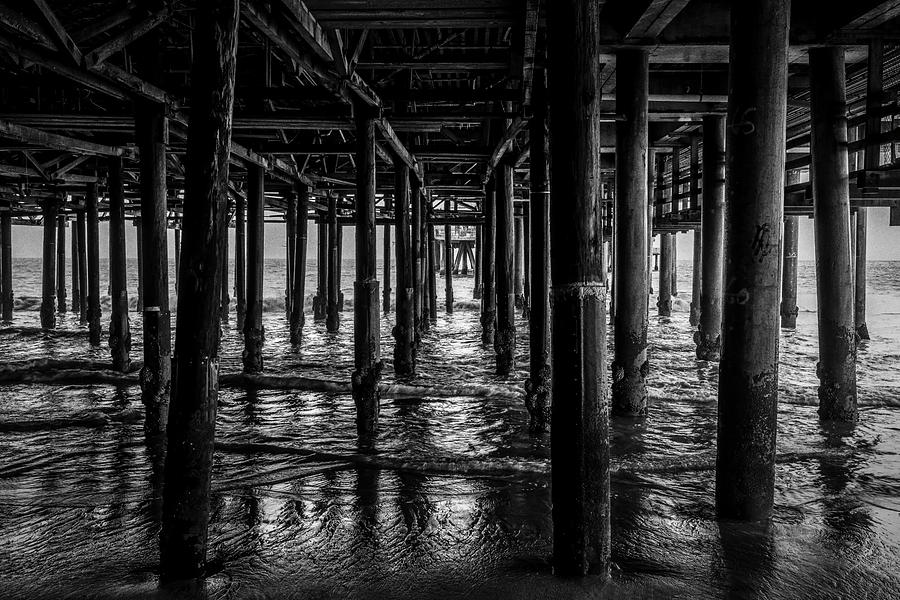 Under The Pier - Black And White Photograph by Gene Parks