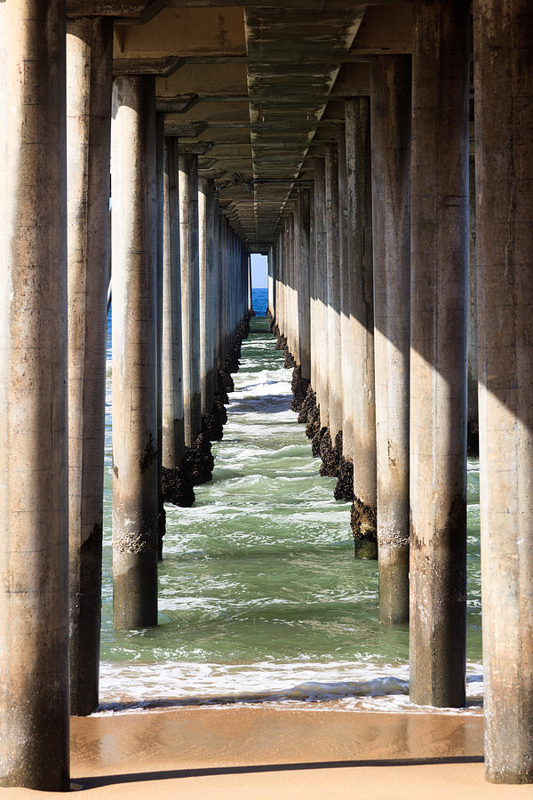 Under the Pier in Orange County California Photograph by Paul Velgos