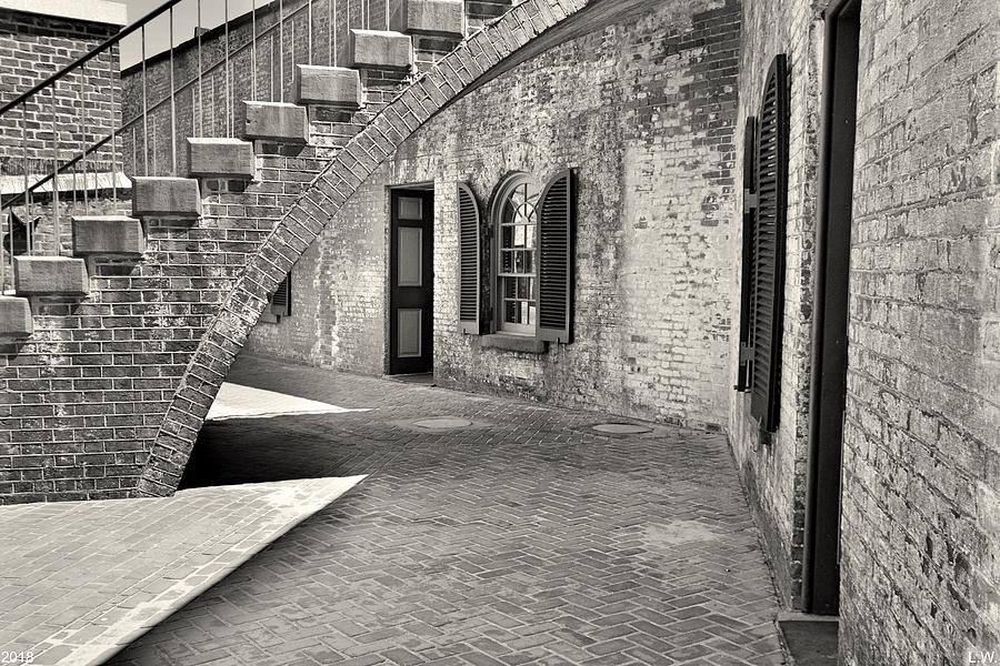 Under The Stairs At Fort Macon Black And White Photograph by Lisa Wooten