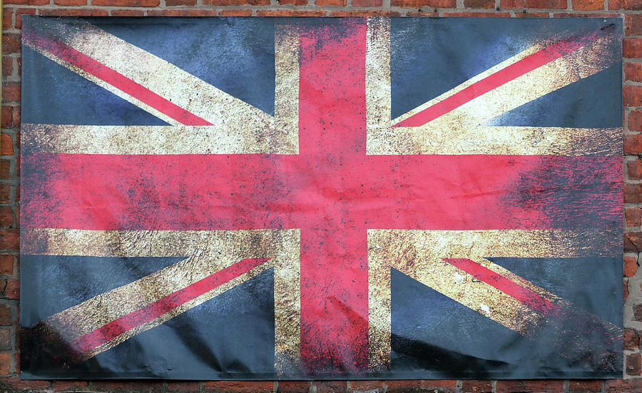 Union Jack British Flag With Dark Crumpled Edges On A Brick Wall ...