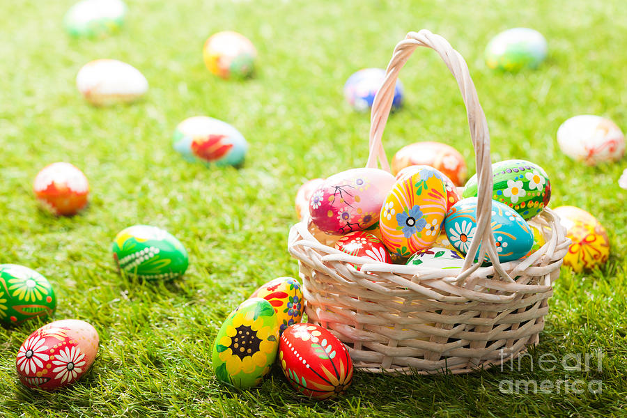 Unique hand painted Easter eggs in basket on grass Photograph by Michal Bednarek