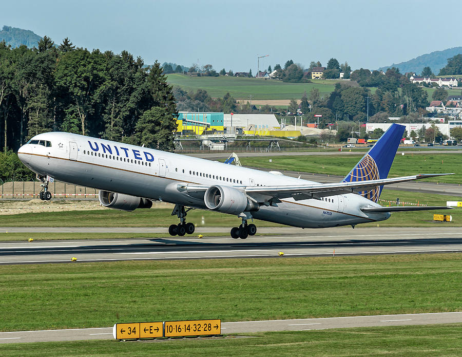 Transportation Photograph - United Airline, Boeing B757 take off from Zurich Airport by Roberto Chiartano