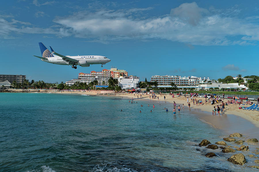 United Airlines 737 landing at St. Maarten airport Photograph by David Gleeson