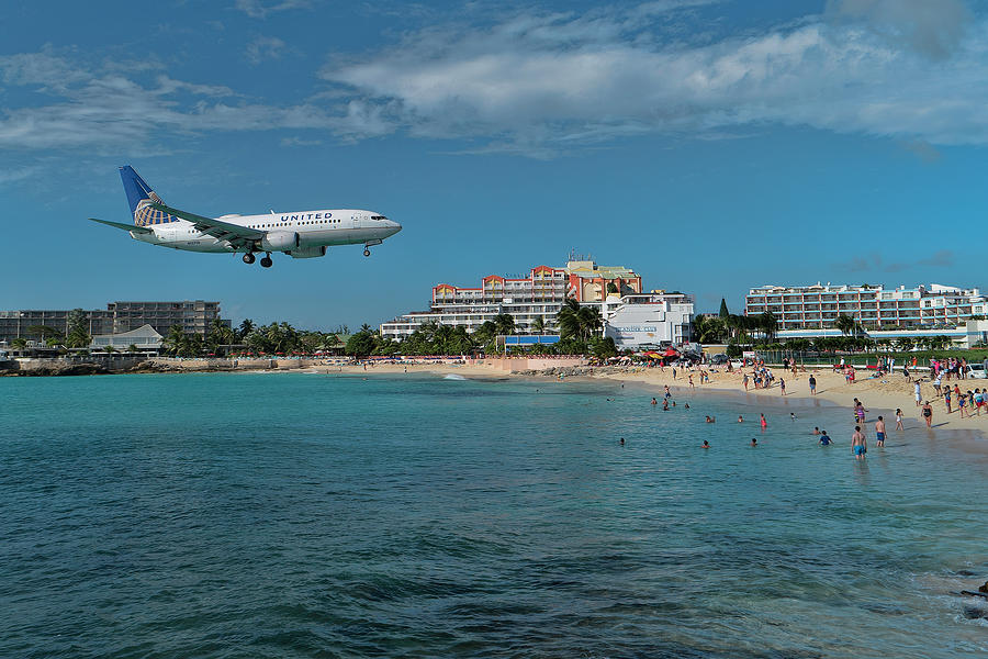 United Airlines landing at St. Maarten airport Photograph by David Gleeson