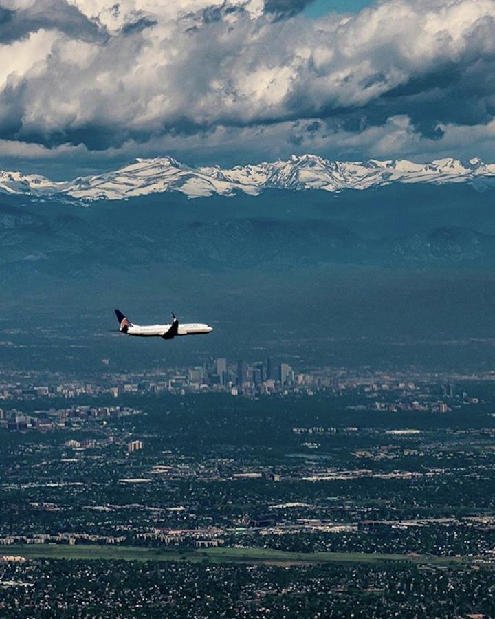 United Flight Caught Between Denver And Photograph by Eric Adams