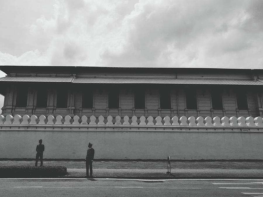 Wall Photograph - Unknown Men Standing With Long Building Behind Traditional Style Wall  by Sirikorn Techatraibhop